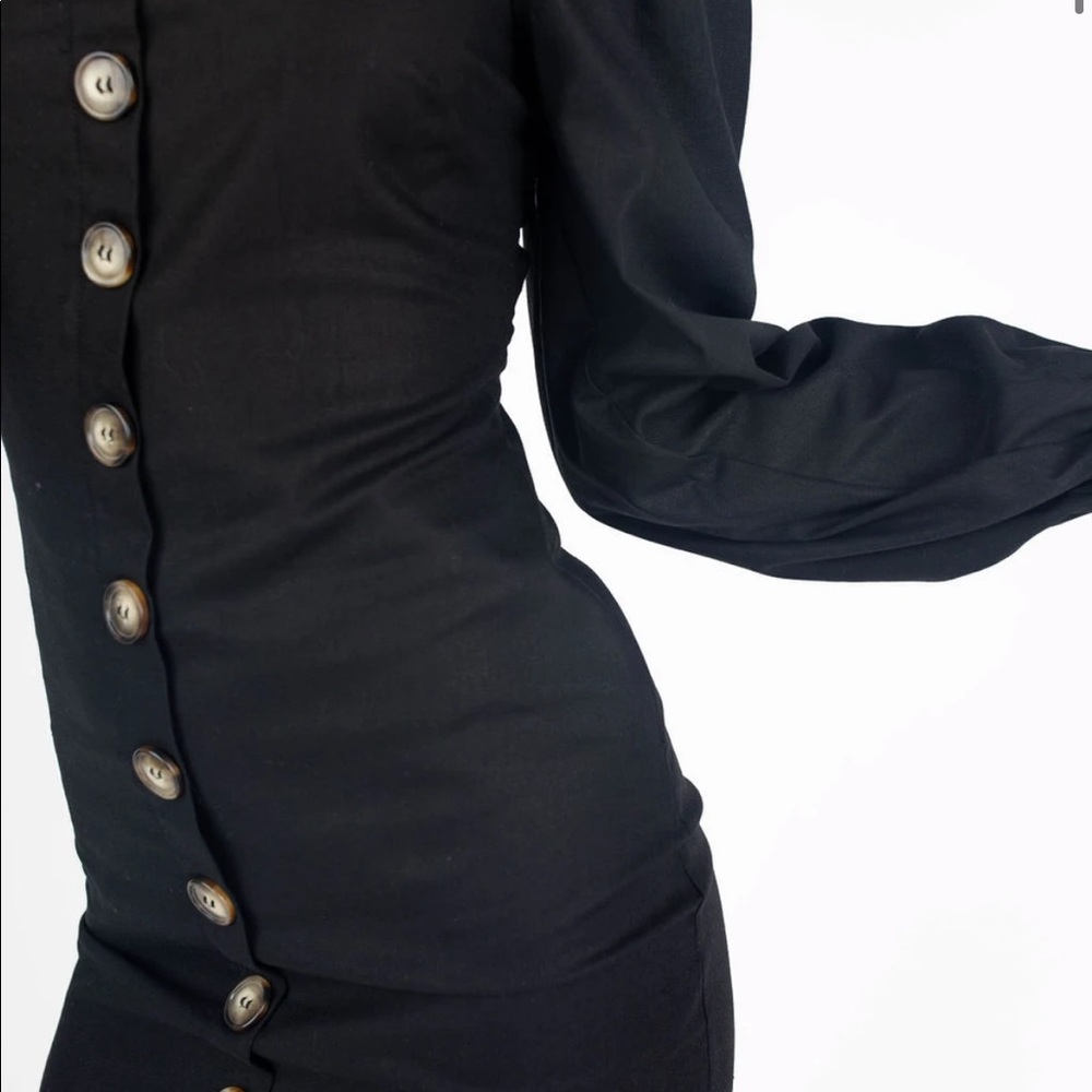 Brand new black kittenish dress in black.